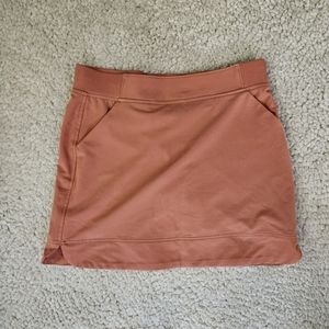 Tennis sports skirt in pinkish orange with pockets and  shorts sizes S